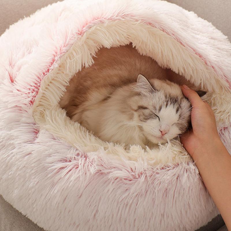 Cat comfortably resting in a Calming Pet Nest, the ultimate comfort bed for cats and dogs, featuring plush faux fur and high walls for added security