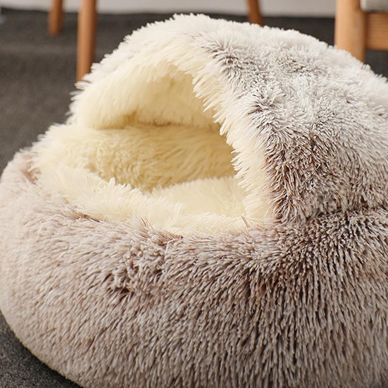 Cat comfortably resting in a Calming Pet Nest, the ultimate comfort bed for cats and dogs, featuring plush faux fur and high walls for added security