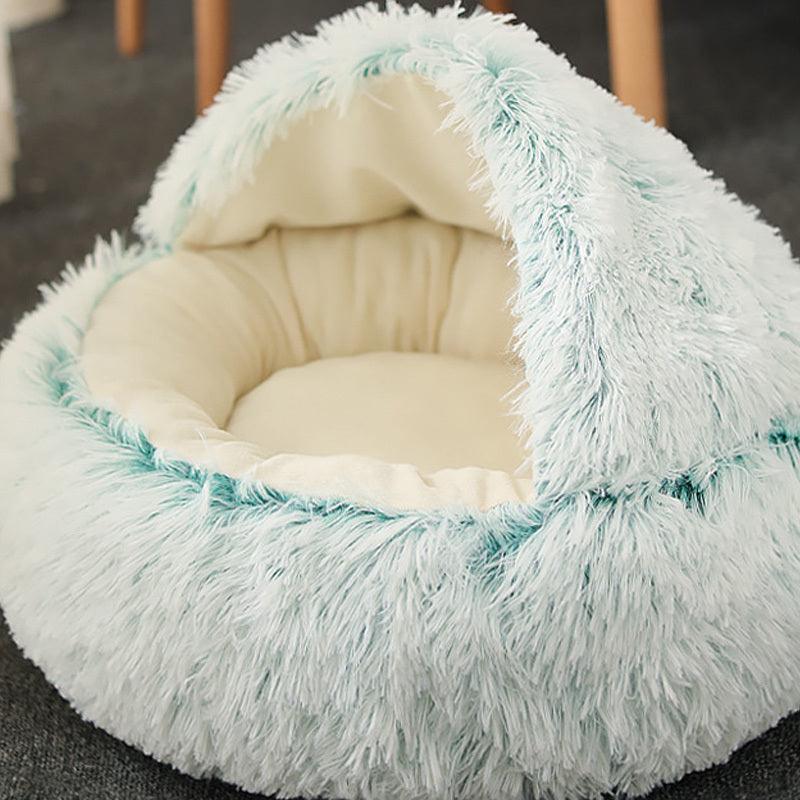 Cat comfortably resting in a Calming Pet Nest, the ultimate comfort bed for cats and dogs, featuring plush faux fur and high walls for added security