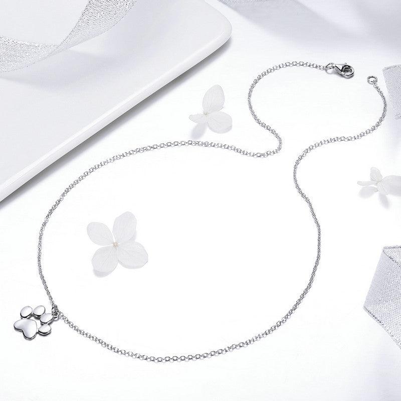 Teeny Tiny Paw Necklace - Delicate paw print pendant necklace, perfect for animal lovers.